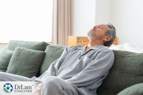 An image of a man lying on a sofa